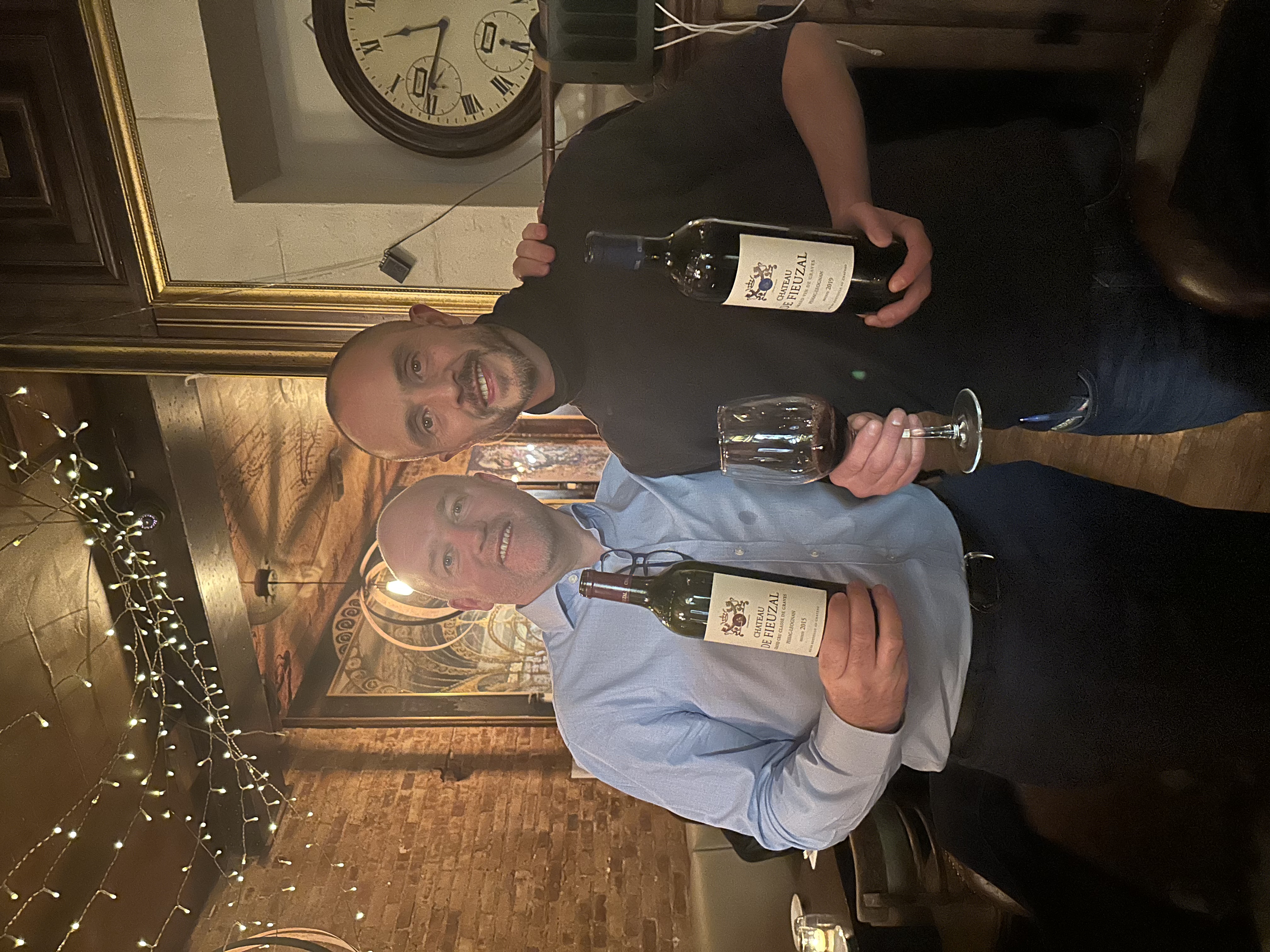 Jerome with Dara from Château de Fieuzal, holding the 2015 and 2019 vintages